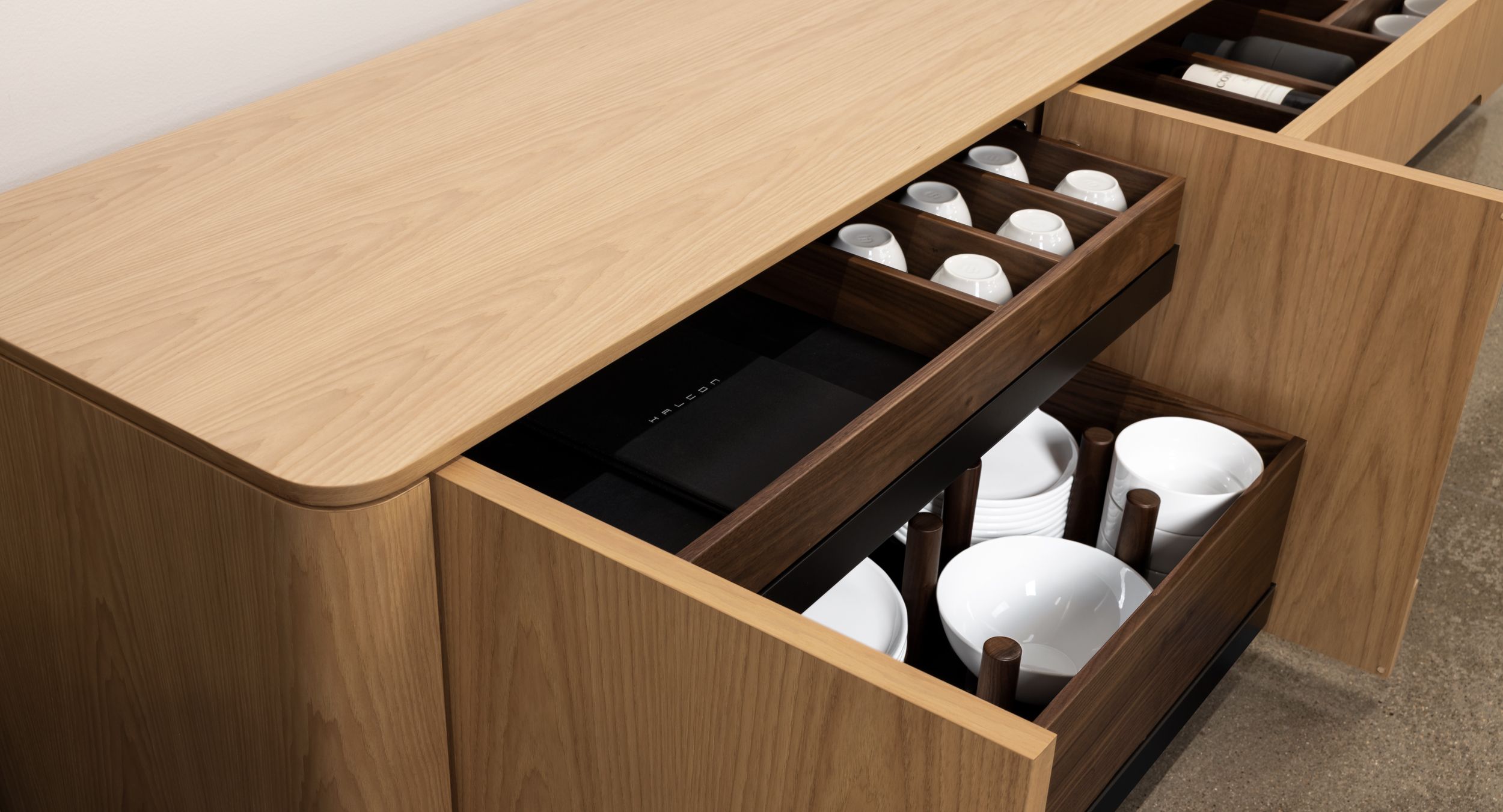 Thoughtful modules accommodate glassware, cutlery, refrigeration, and more.  Solid wood storage trays are easily removed for fast and convenient service.