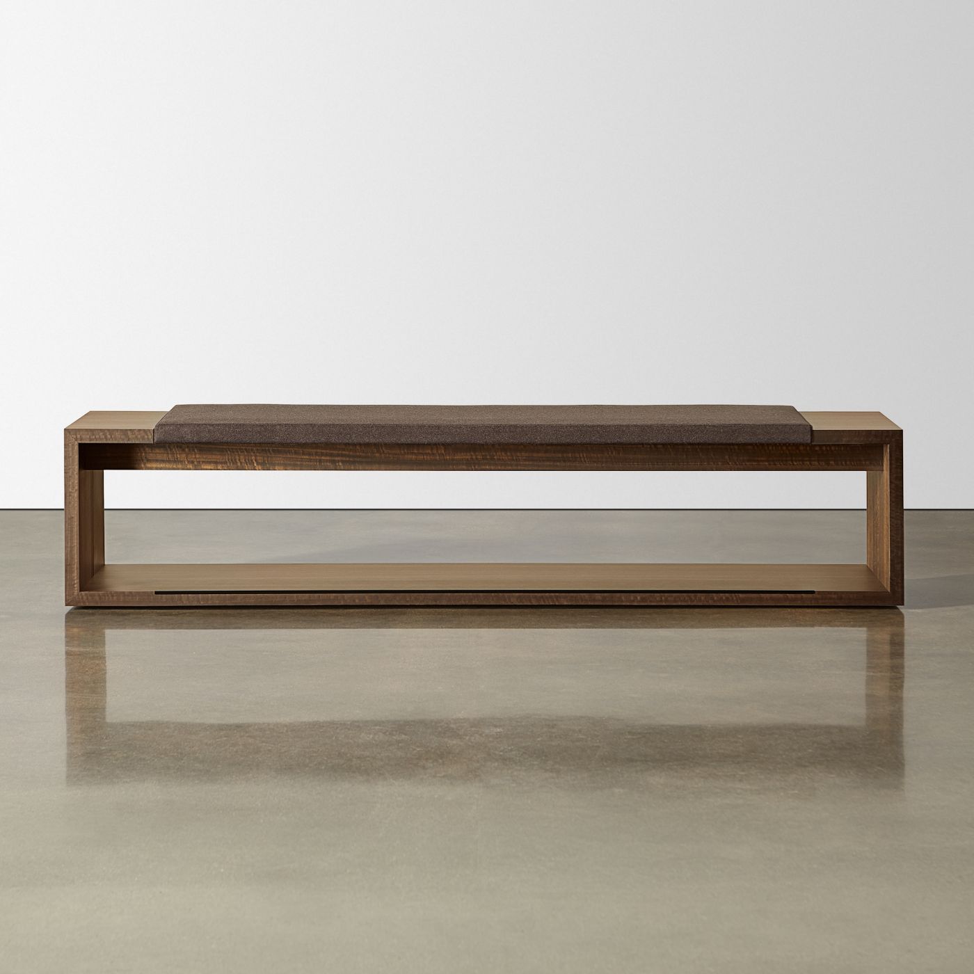Each bench includes a gracious seating cushion and convenient end table surfaces.