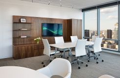 This custom media wall showcases HALCON craftsmanship with sequenced-matched flat cut walnut veneer. thumbnail