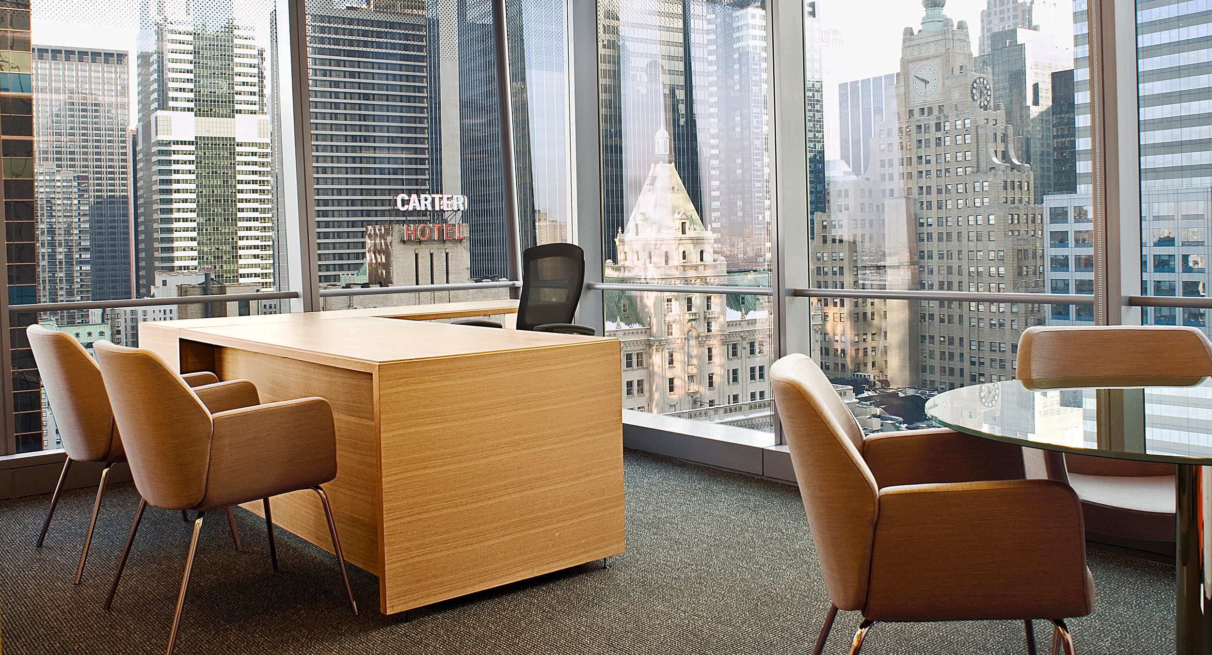 HALCON provided nearly 200 unique partner office configurations and also provided ancillary pieces including round glass tables.