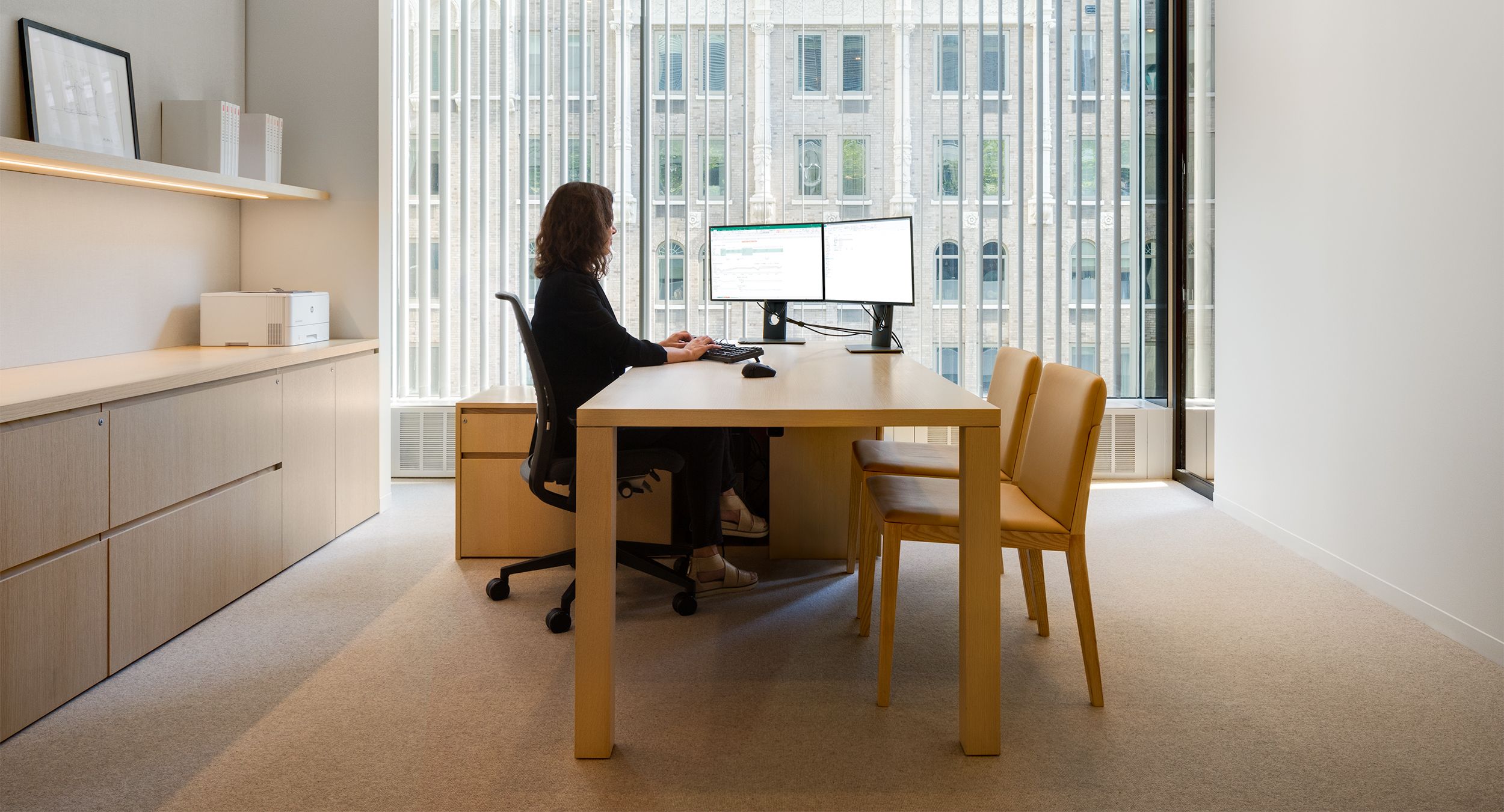 NEW MILLENNIA desking and storage is perfectly-tailored to enhance the workspace.