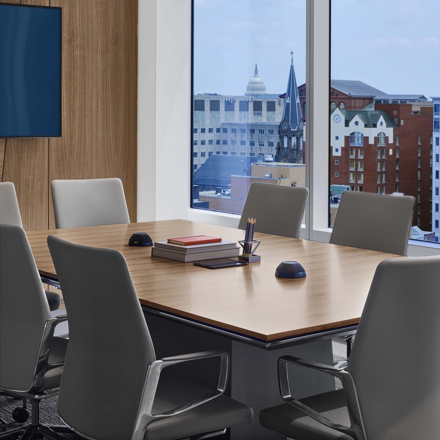 Venable features MESA conferencing in a variety of shapes and materials including this table in Polished Chrome and Paldao wood veneer