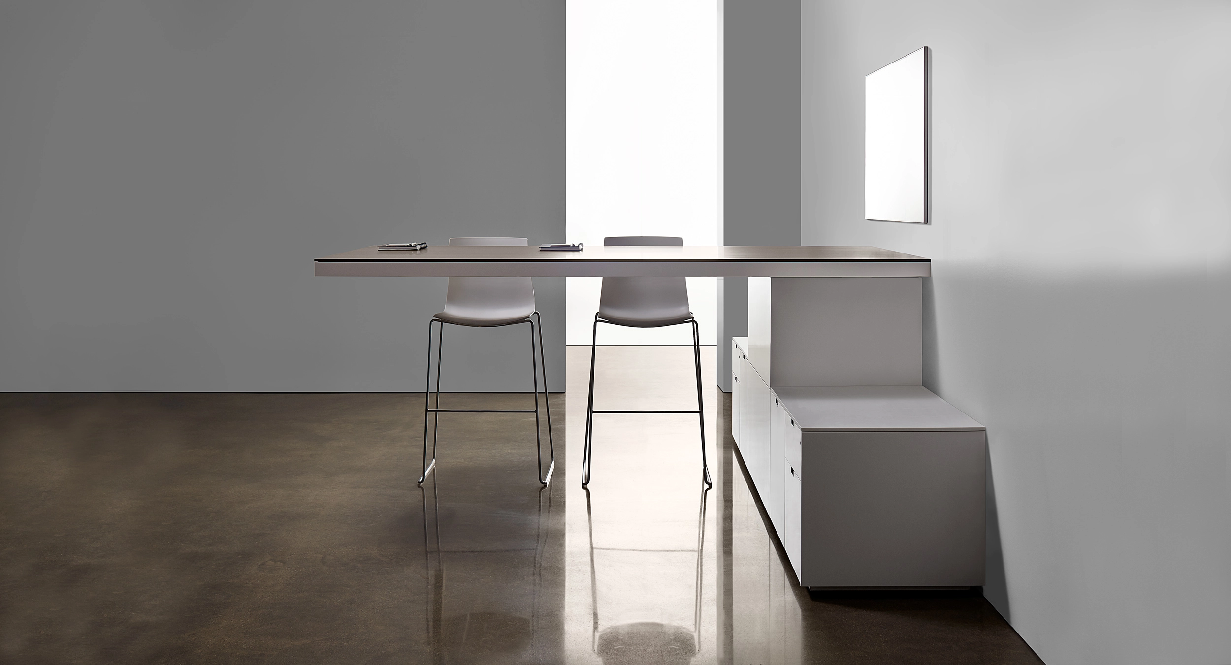 Defy gravity with a free-floating, cantilevered standing-height table.