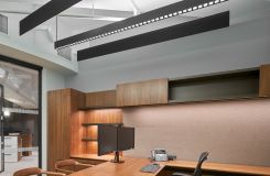 Custom Private Office with adjustable-height surface in Flat Cut Figured Walnut, Bronze Metallic, and LUUM Percept tack panel. thumbnail