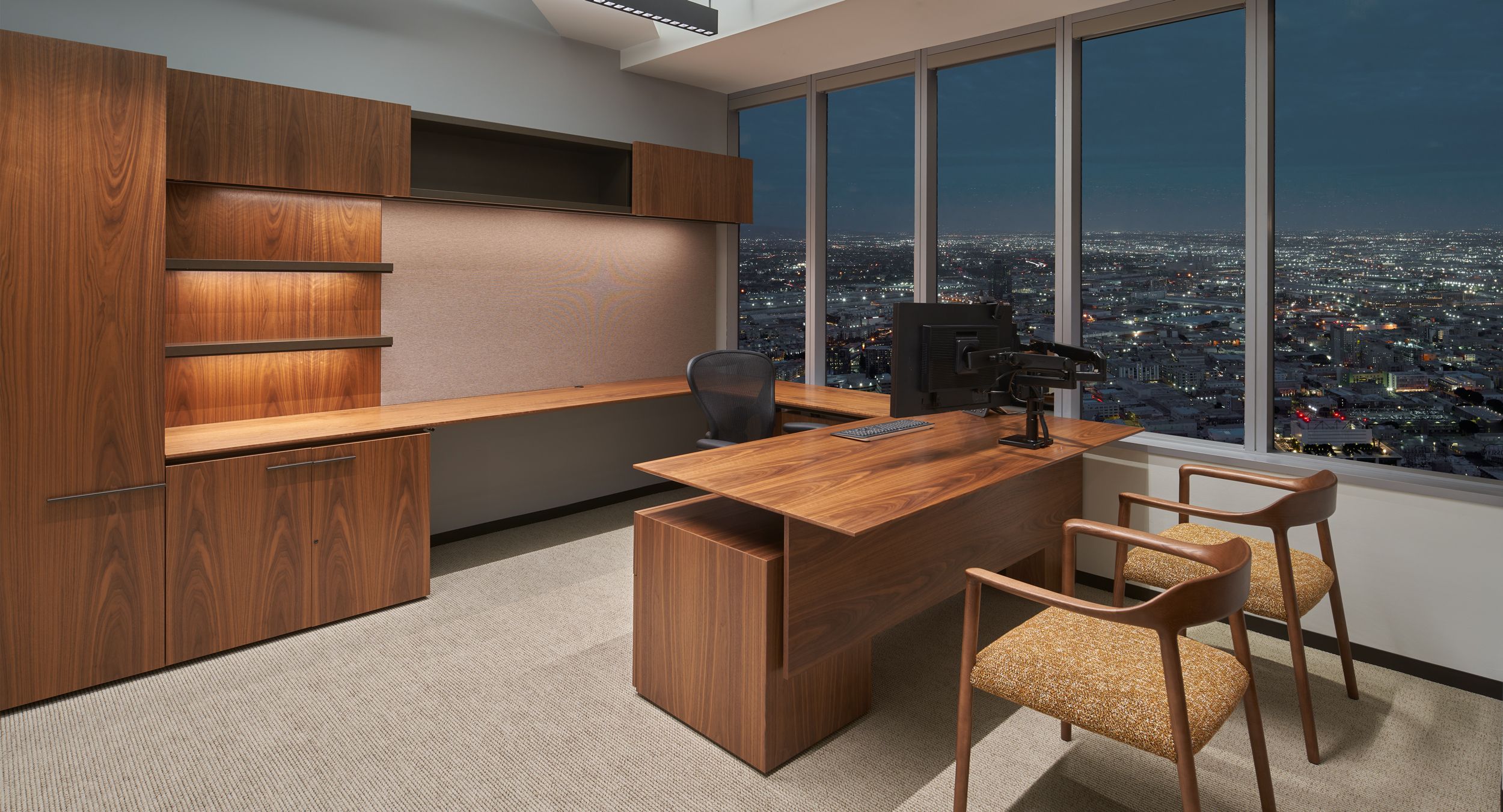 Custom Private Office with adjustable-height work surface has commanding views over the city.