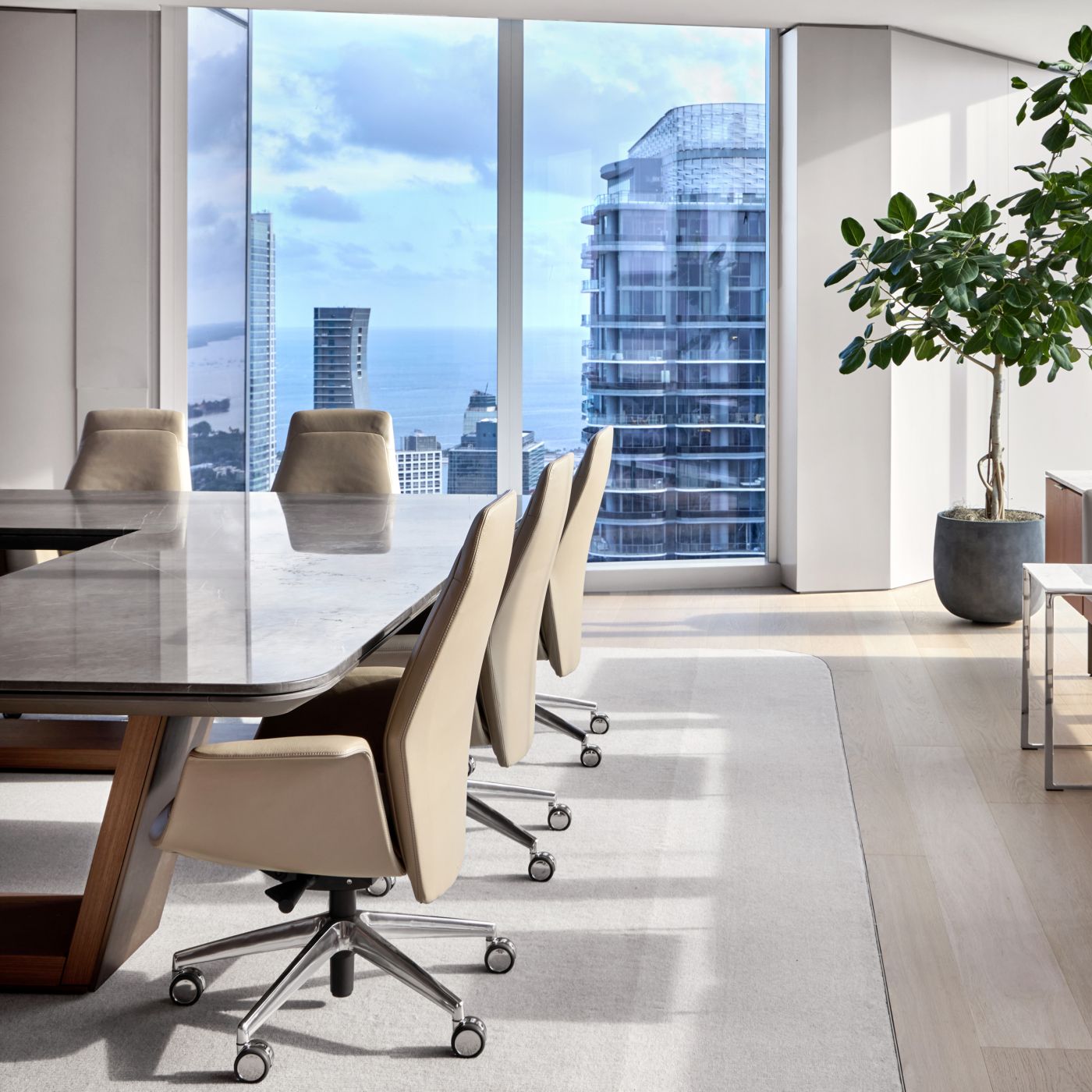 Custom 120 x 228 HALO conference table Mount Grey stone surface, Mink HALO Soft Edge with Walnut and Deep Bronze OPTIC Loop base.