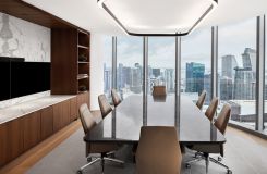 A custom HALO / OPTIC conference table is the centerpiece for this executive meeting space. thumbnail