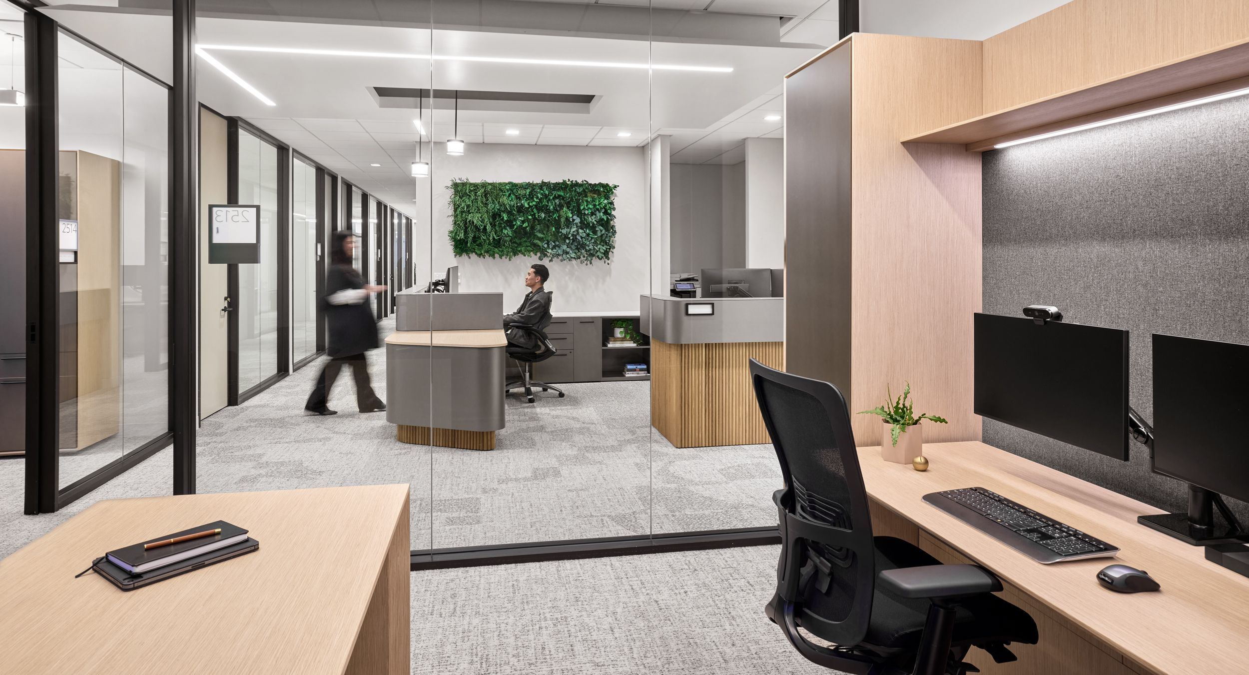 White Oak tambour, etched-glass, FENIX and Light Luxe Metallic make up this custom reception station.