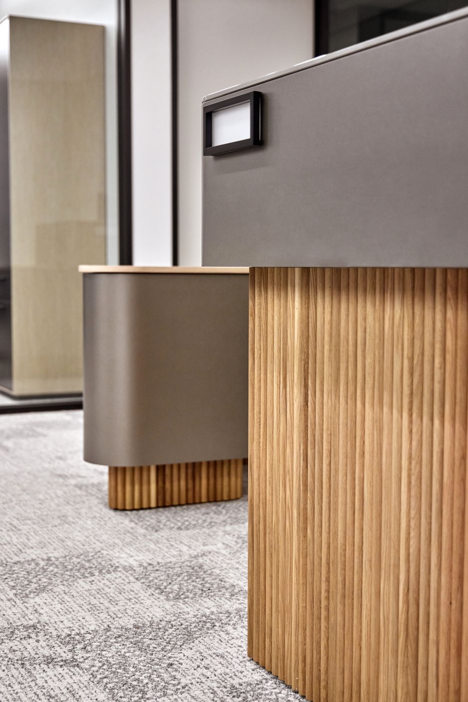 A compelling mix of materials on a custom reception space are both functional and beautiful.