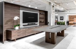 FREYA conference table with linear power bay, back-wall, and credenza in custom figured Paldao and Light Bronze. thumbnail