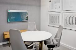 HALO table with custom acid-etched glass surface and custom Y-base finish. A pair of cerused oak HALO credenzas complete the space. thumbnail