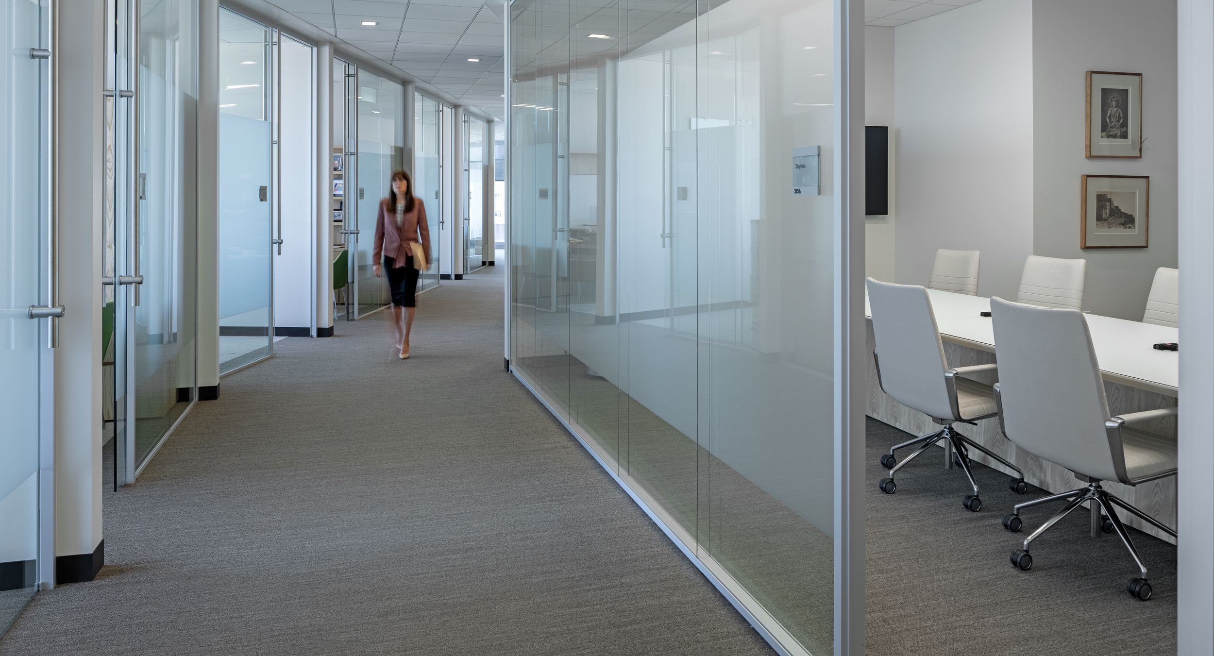 HALO conference table in flat cut Sen with Moonbeam Silver back-painted glass surface