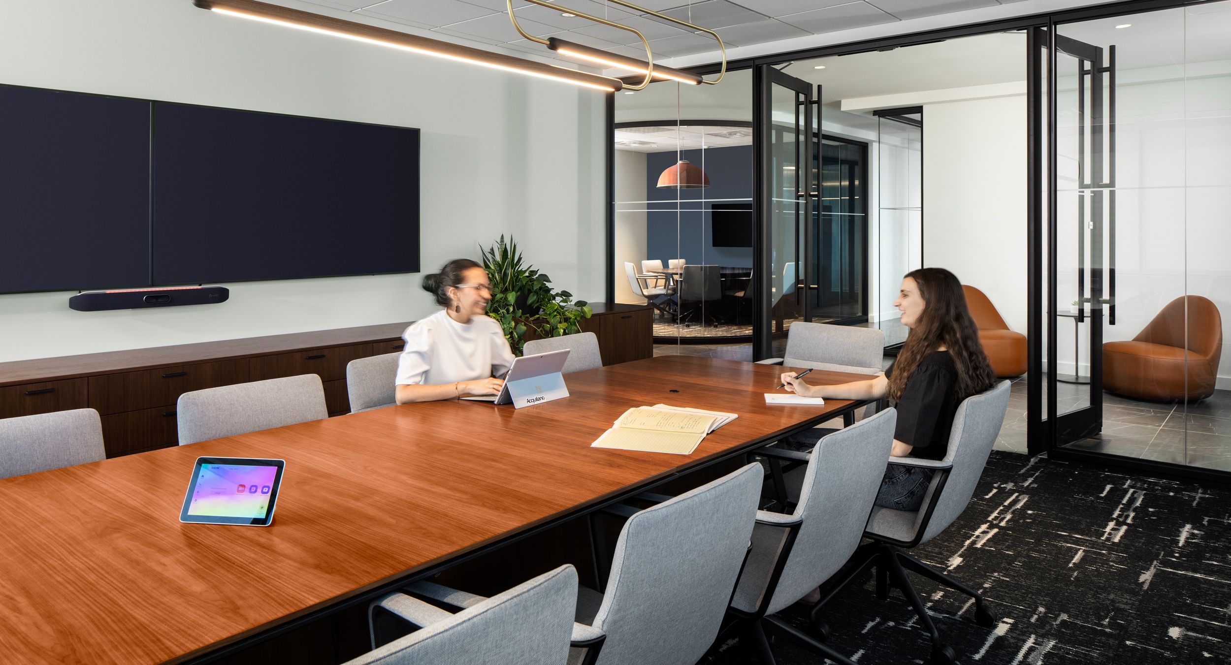 A soft rectangle HALO conference table and a custom 262w credenza in Natural Flat Cut Walnut.