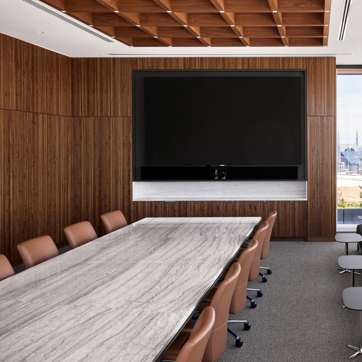 Stone surfaced Halo conference table with Halo Soft Edge in Mink.