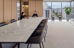 60 x 300 Halo table with stone surface, Black Halo Soft Edge, and Deep Bronze Y-base. thumbnail