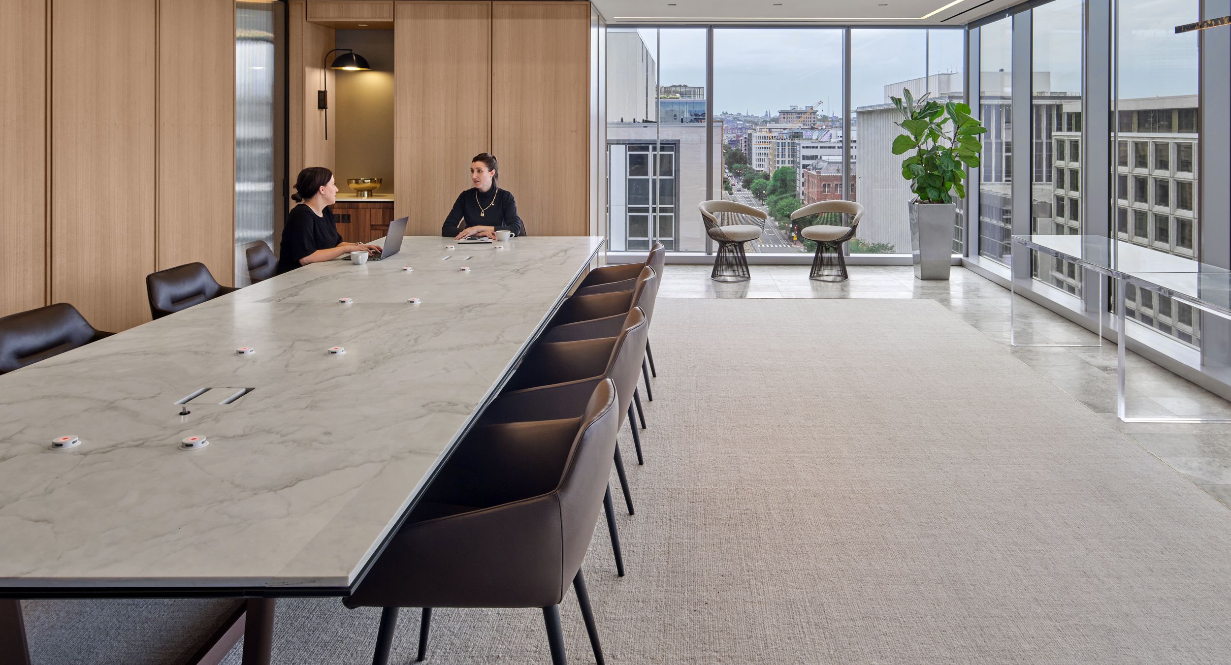 60 x 300 Halo table with stone surface, Black Halo Soft Edge, and Deep Bronze Y-base.