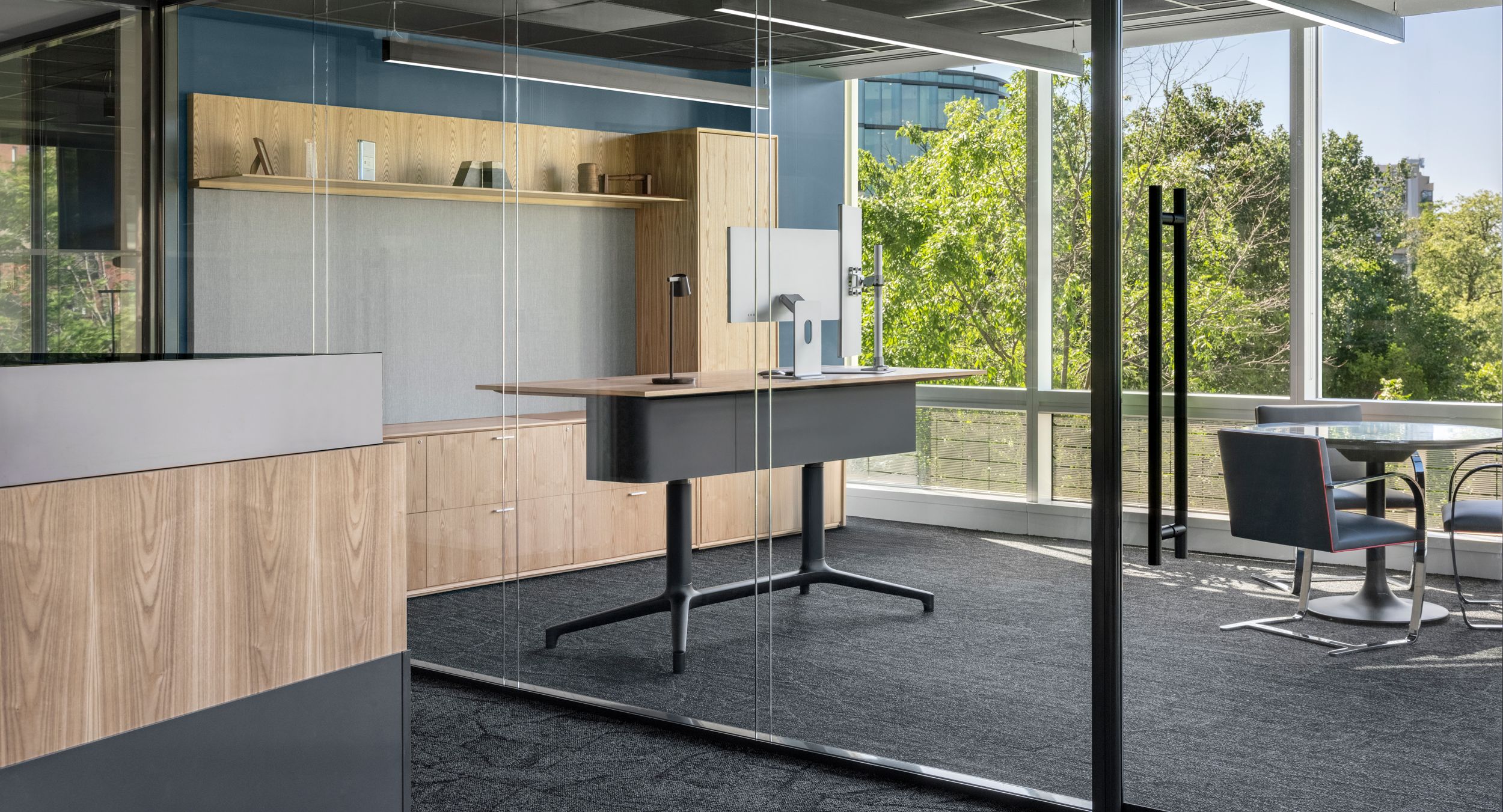 A complete HALCON custom solution including custom Helm adjustable-height desk, work wall, meeting table, and reception station.