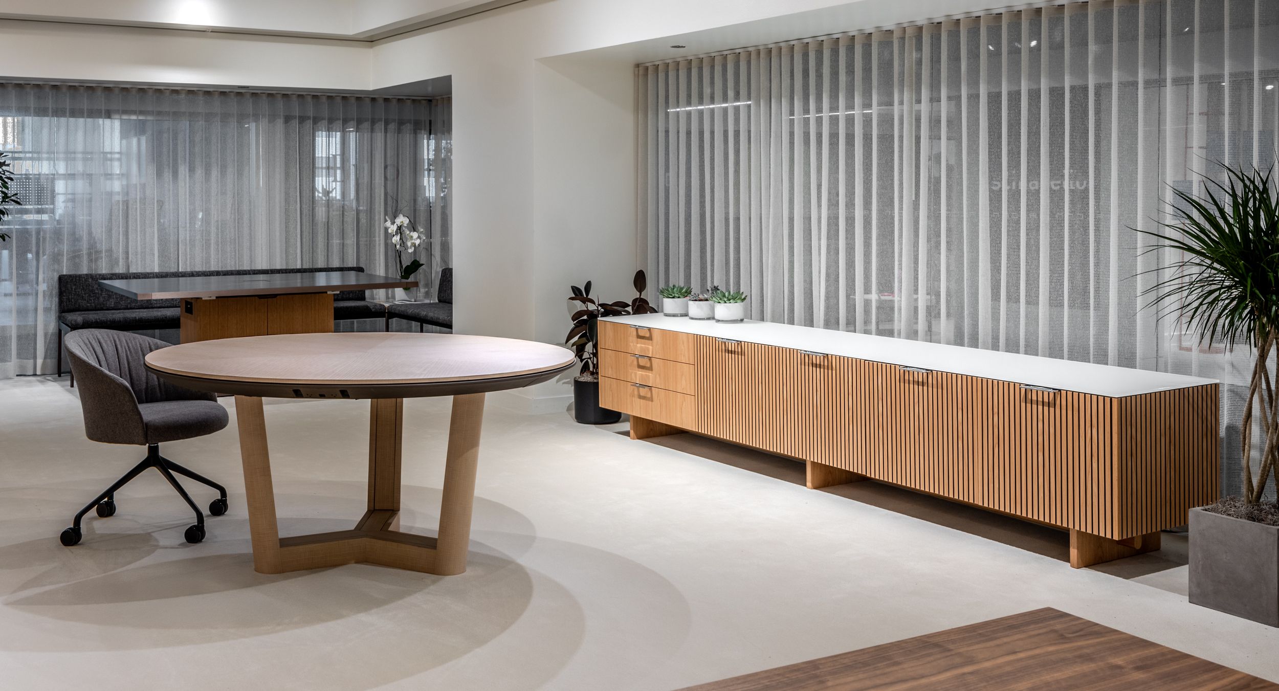 HALO wood-based conference table in Cream Ash and Mink accompanied by an stunning FREYA credenza in August Hickory and chrome.