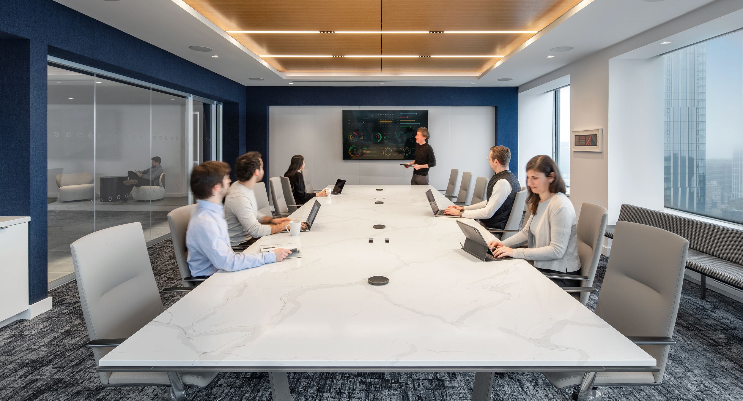 72 x 216 Custom Halo conference table with 2cm stone surface and Mesa loop base.