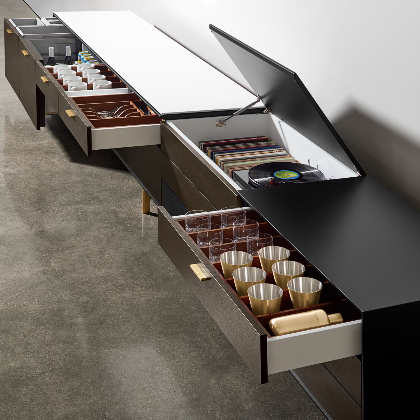 Glassware, refrigeration, entertainment, food service and cleanup are some of the innovative elements of a Halo sideboard.