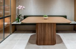 Walnut Astoria Cafe' table with a HALO bench in Light Bronze, Chiarra, and Novasuede. thumbnail