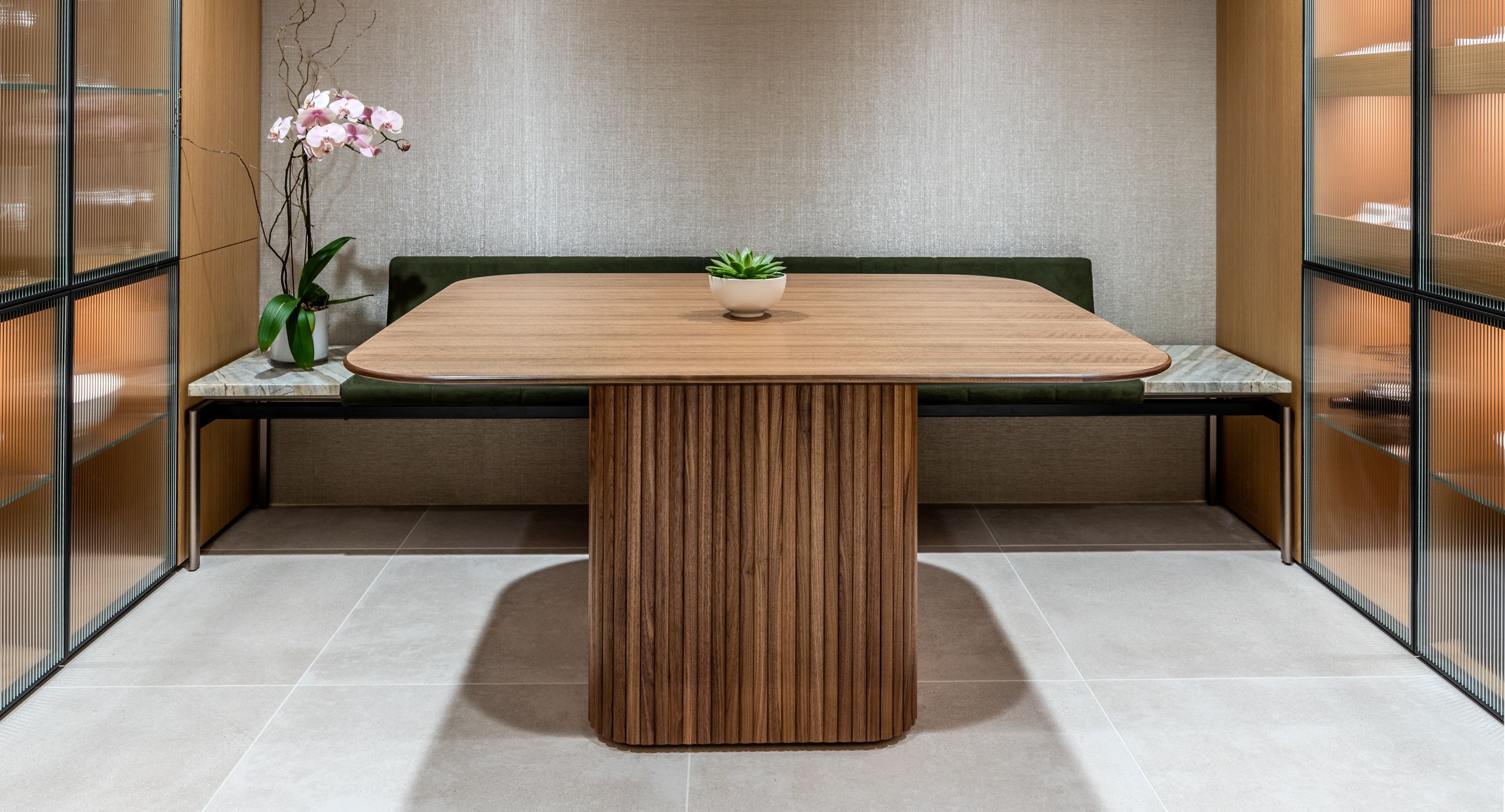 Walnut Astoria Cafe' table with a HALO bench in Light Bronze, Chiarra, and Novasuede.