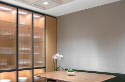 Figured Walnut ASTORIA cafe table with wood tambour base anchors this luxurious communal space. thumbnail