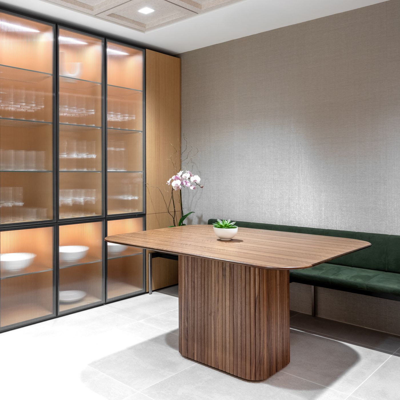 Figured Walnut ASTORIA cafe table with wood tambour base anchors this luxurious communal space.