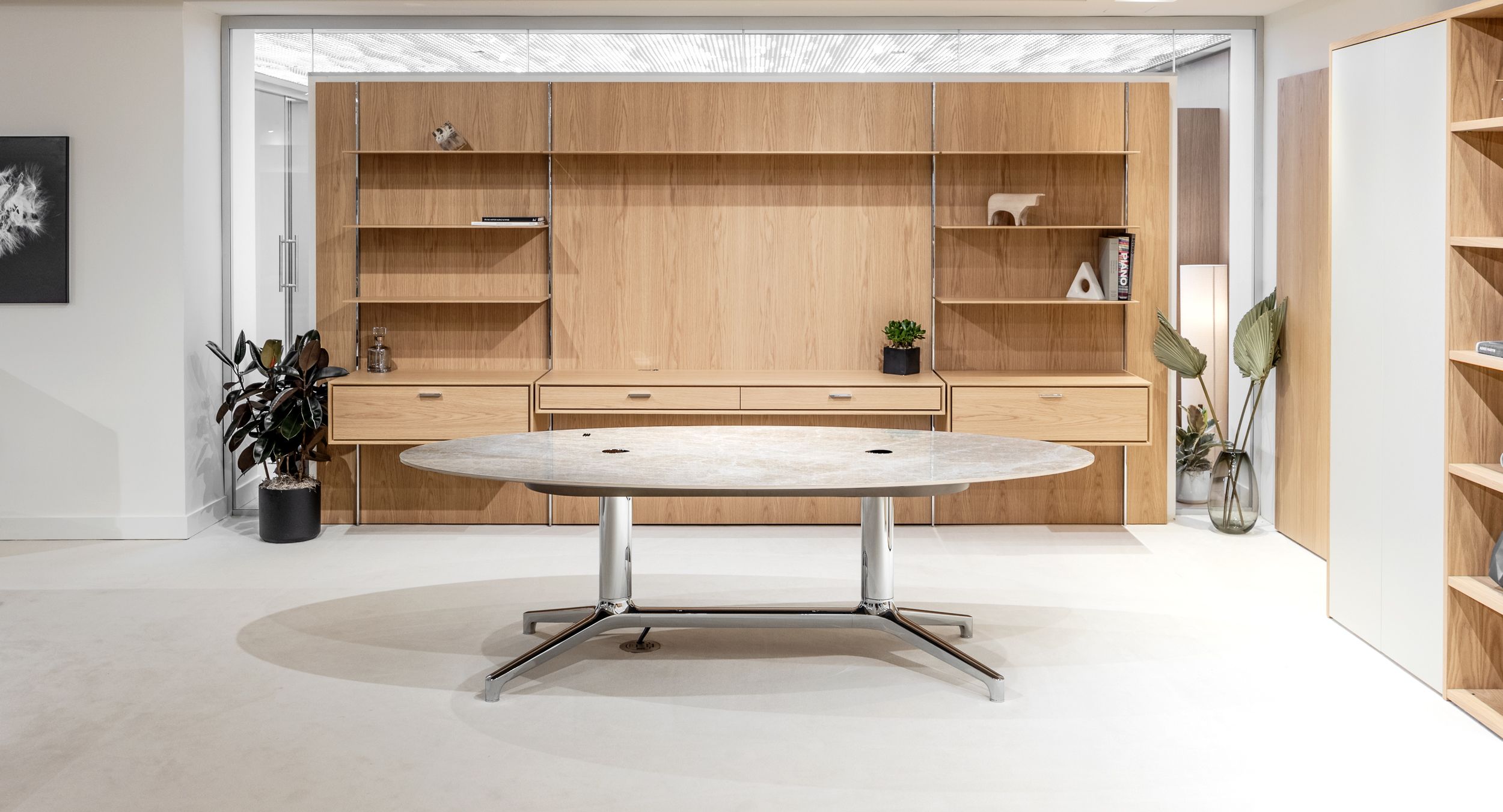 Stunning HALO OFFICE Executive work wall in custom white Oak is the perfect complement to the timeless design of the HELM adjustable-height desk.