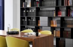 A beautiful Walnut HUGO table is the centerpiece of this meeting space. thumbnail