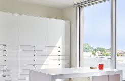 Our sample room features custom LEX storage and HUGO table in Designer White. thumbnail