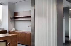 NEW MILLENNIA private offices include adjustable-height desking and continuous floating shelves. thumbnail