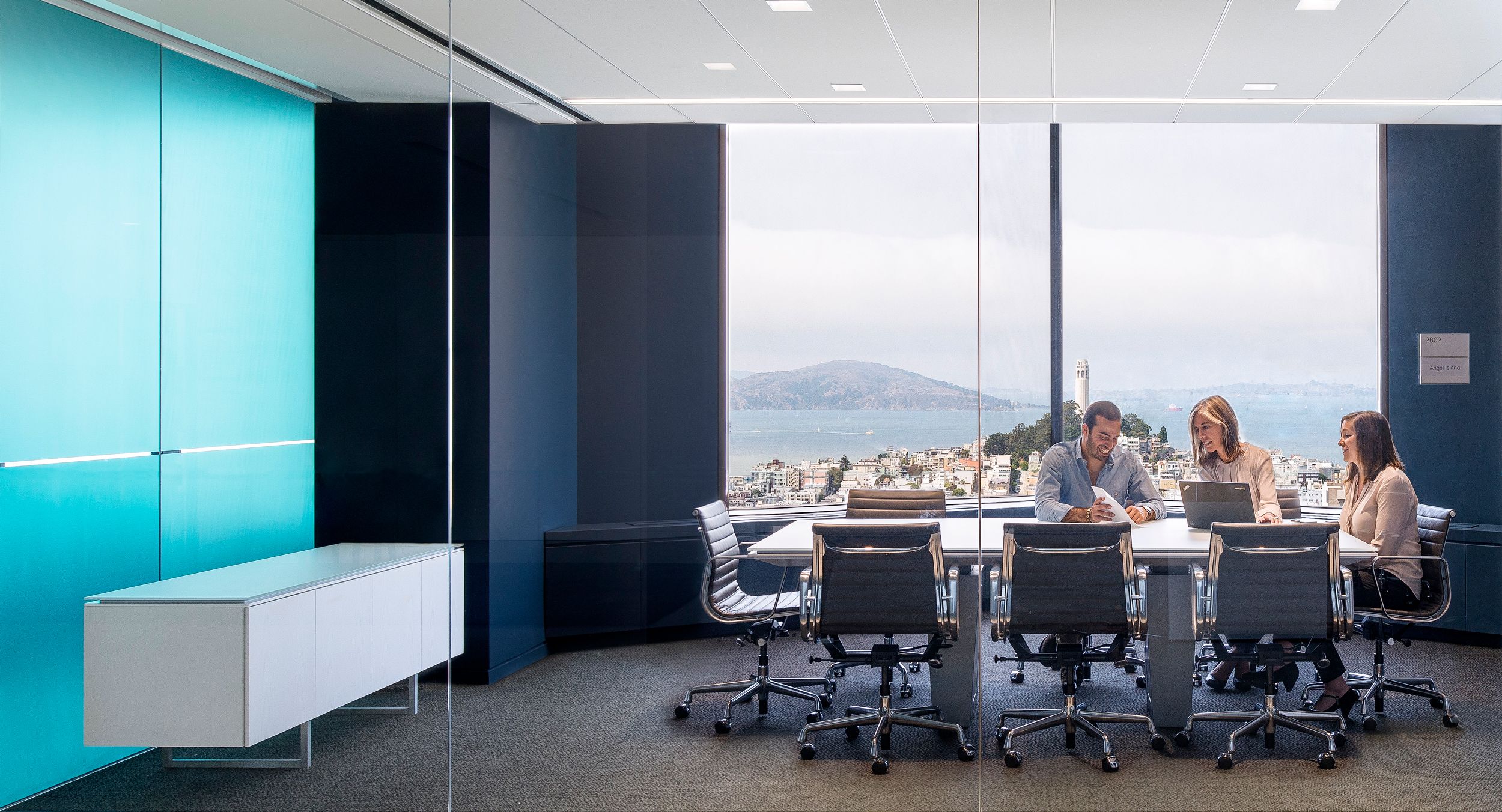 A MESA table and matching credenza feature beautiful, durable etched glass surfaces.