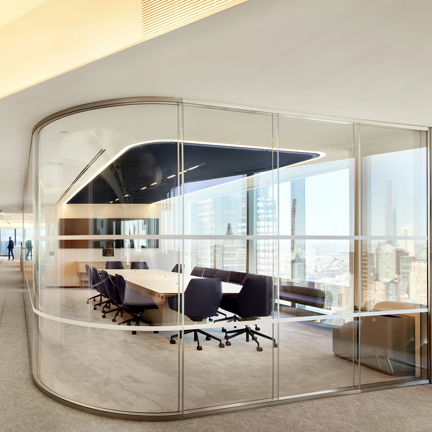 Etched glass MESA table with continuous base is central to the sophisticated feel of this meeting space.