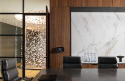 MESA table with a continuous base of bookmatched white oak, and polished chrome trim. thumbnail