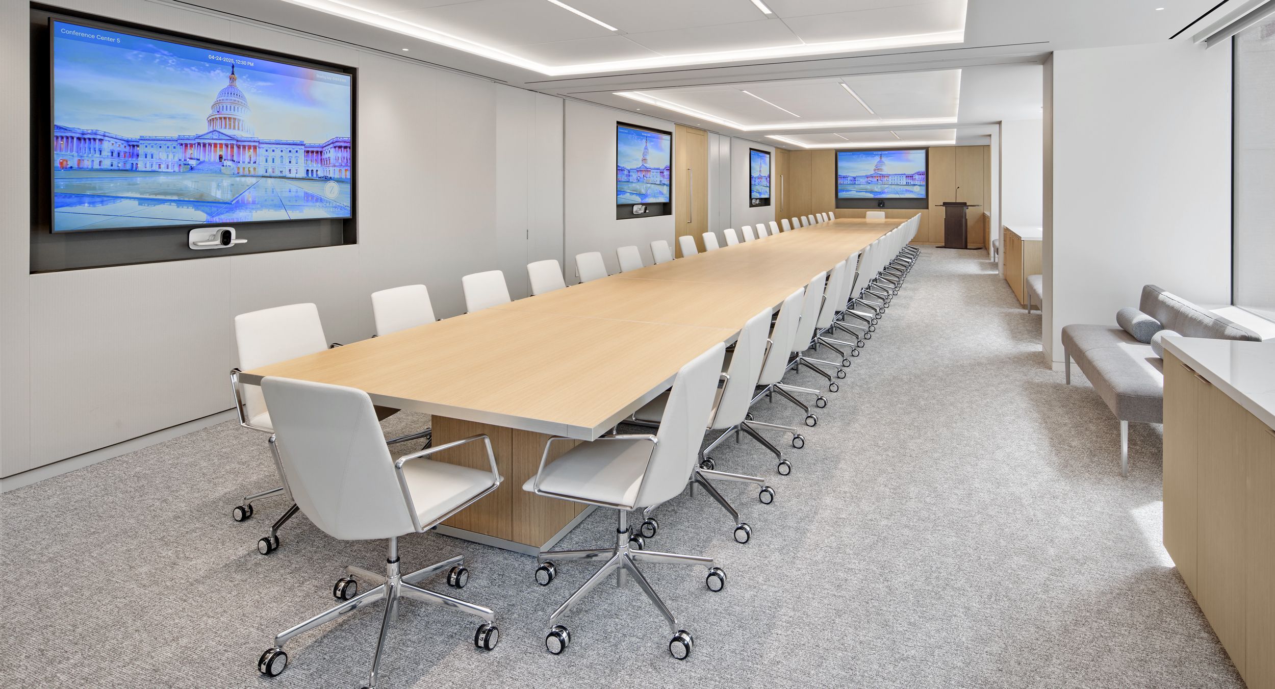Motus tables in book-matched White Oak bring an executive level finish to this reconfigurable space.