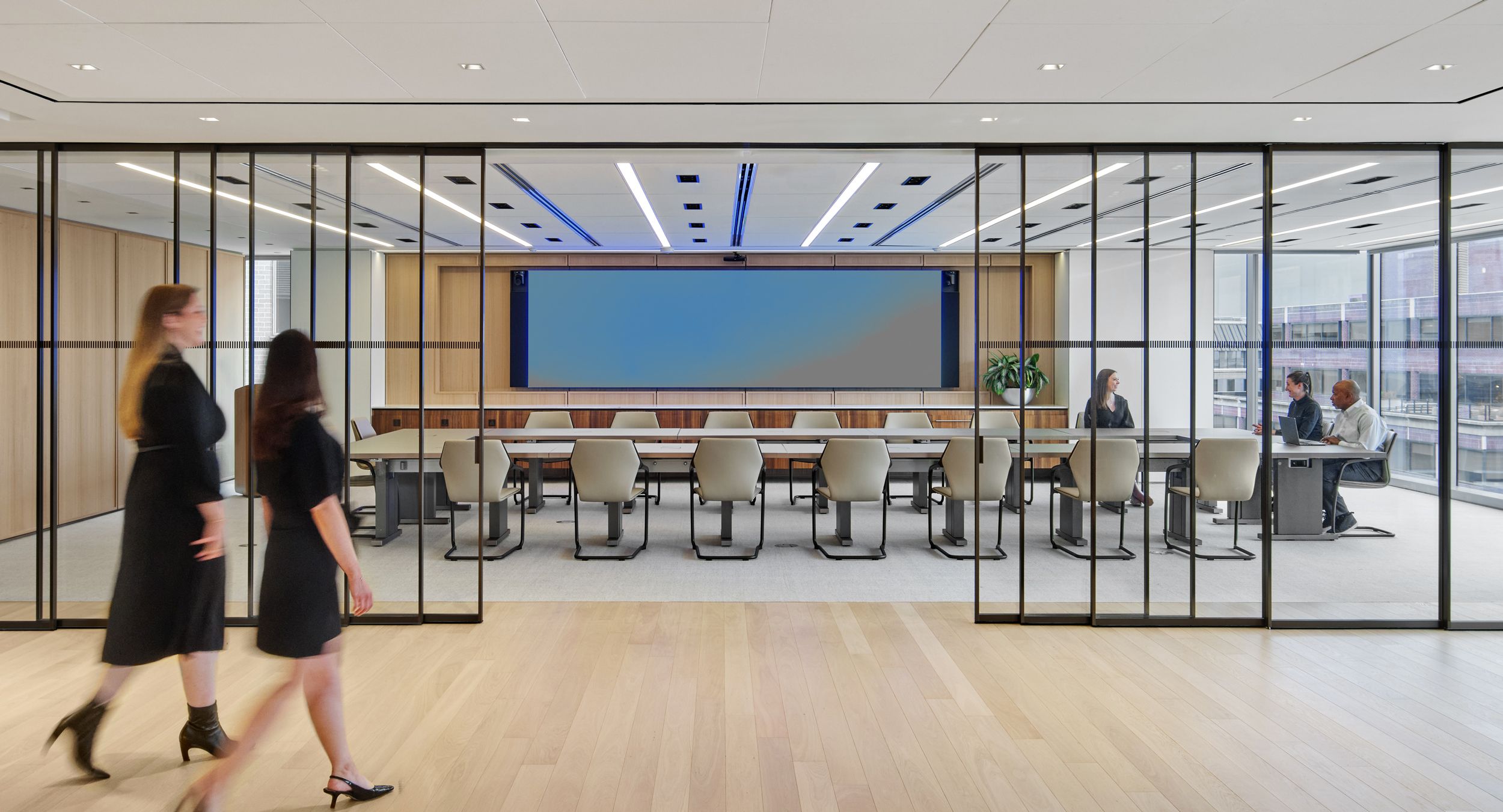 Glass surfaced Motus tables bring an executive level finish to this reconfigurable space.