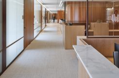 Custom New Millennia 2-seat workstation in Natural Figured Eucalyptus with Calacatta Sponda transaction surfaces. thumbnail