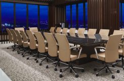 66 x 240 Optic conference table in figured Walnut and Deep Bronze base, with a stone surfaced Halo top is a stunning combination. thumbnail