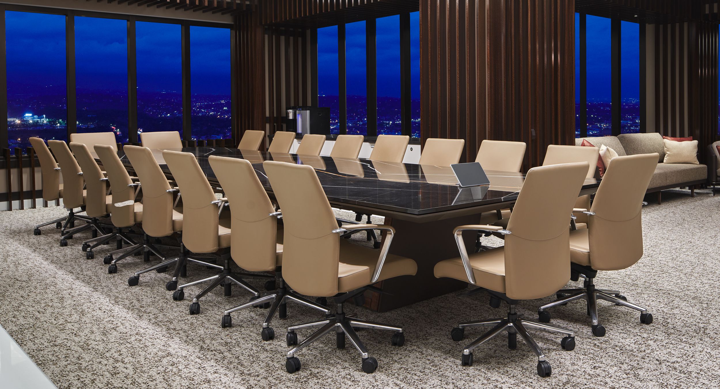 66 x 240 Optic conference table in figured Walnut and Deep Bronze base, with a stone surfaced Halo top is a stunning combination.