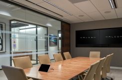 Figured Walnut Stratos conference table with Deep Bronze base. thumbnail