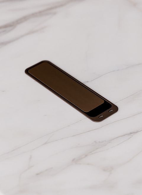 Power is seamlessly integrated into the table surface, making technology conveniently accessible.