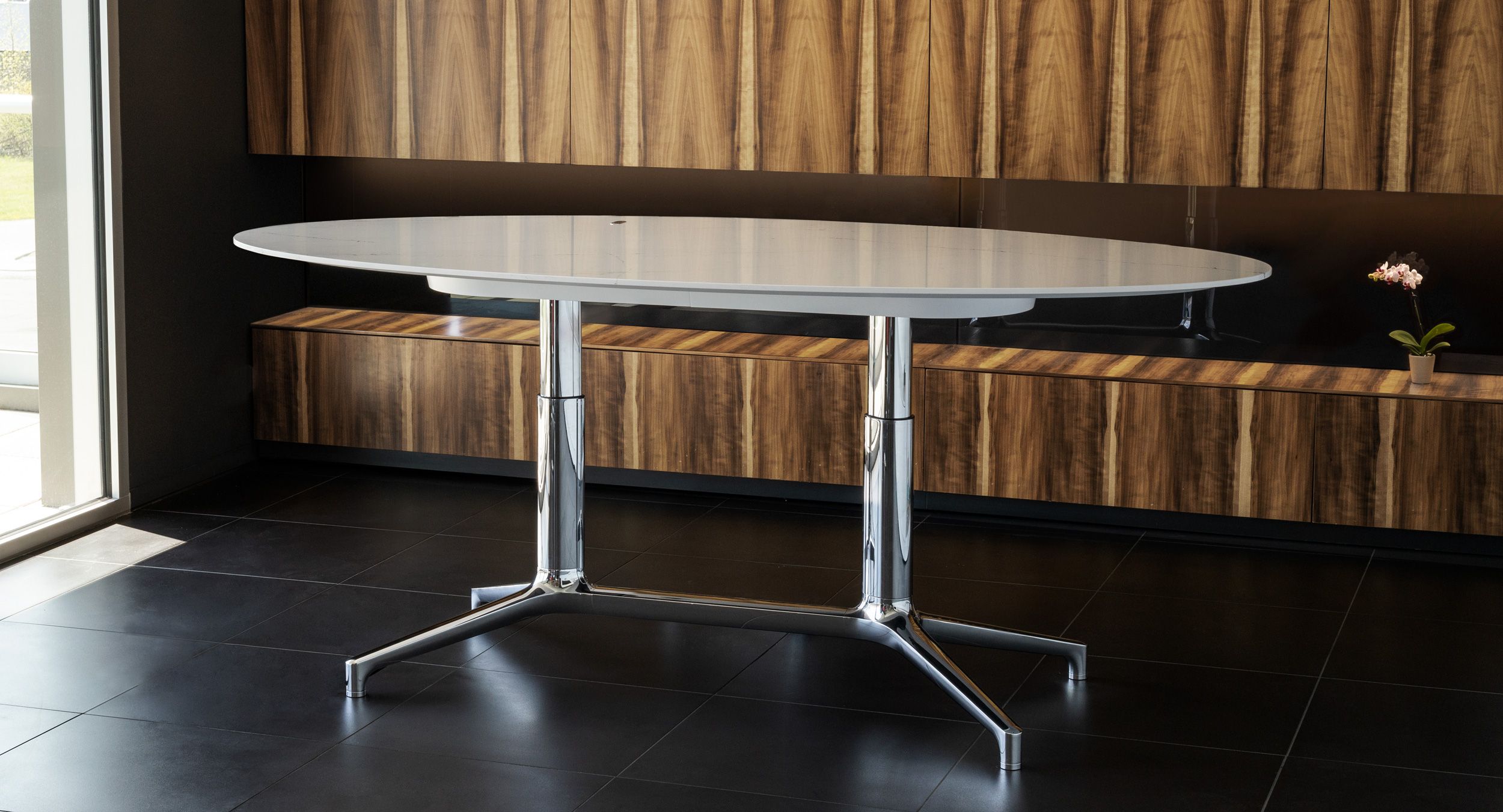 Adjustable-height ergonomics are integrated into a beautifully sculpted, timeless metal base.