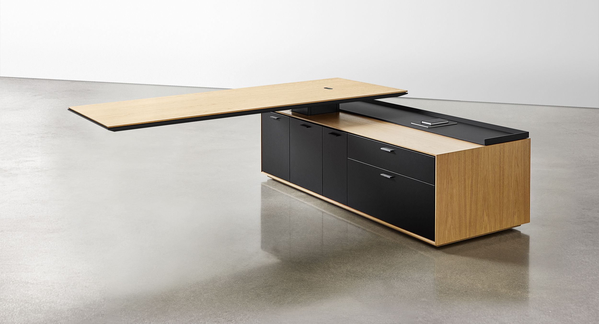 Defy gravity with an adjustable-height, cantilevered desk surface.