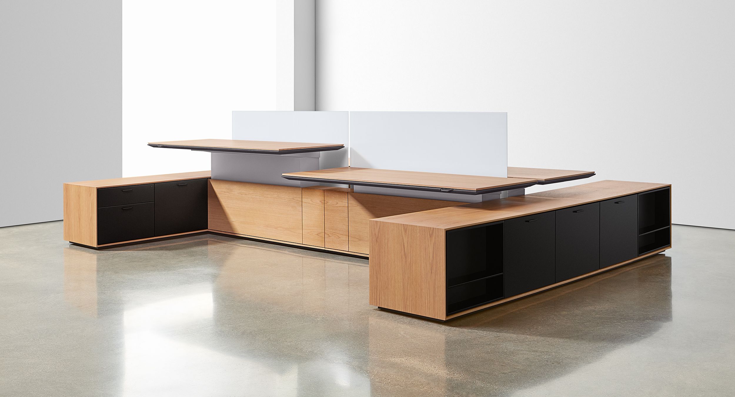 Adjustable-height desking and thoughtful storage are beautifully integrated into a total solution.