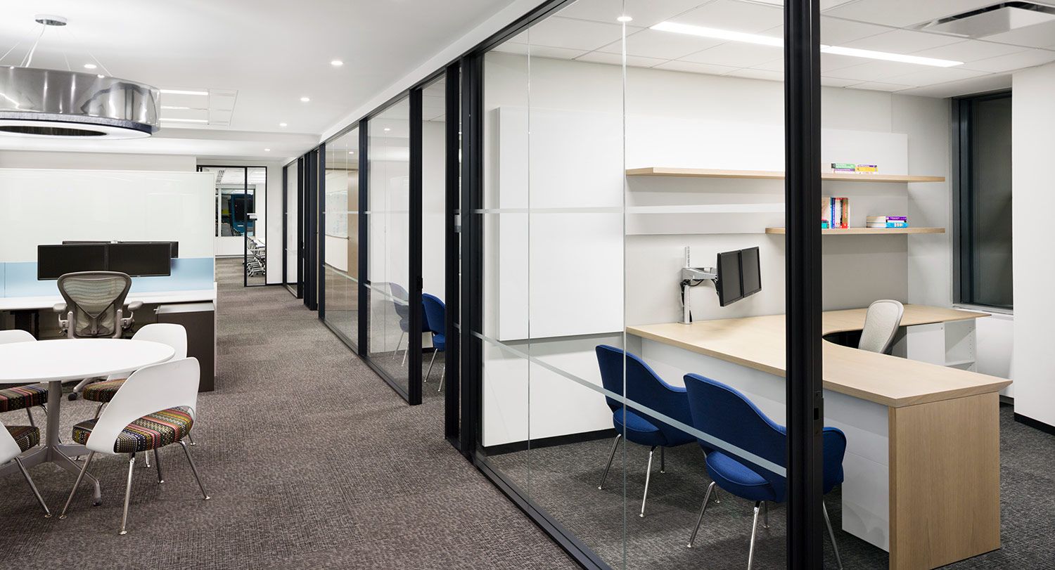 Our client's unique vision and exacting specifications resulted in fully customized private offices and open plan benching.