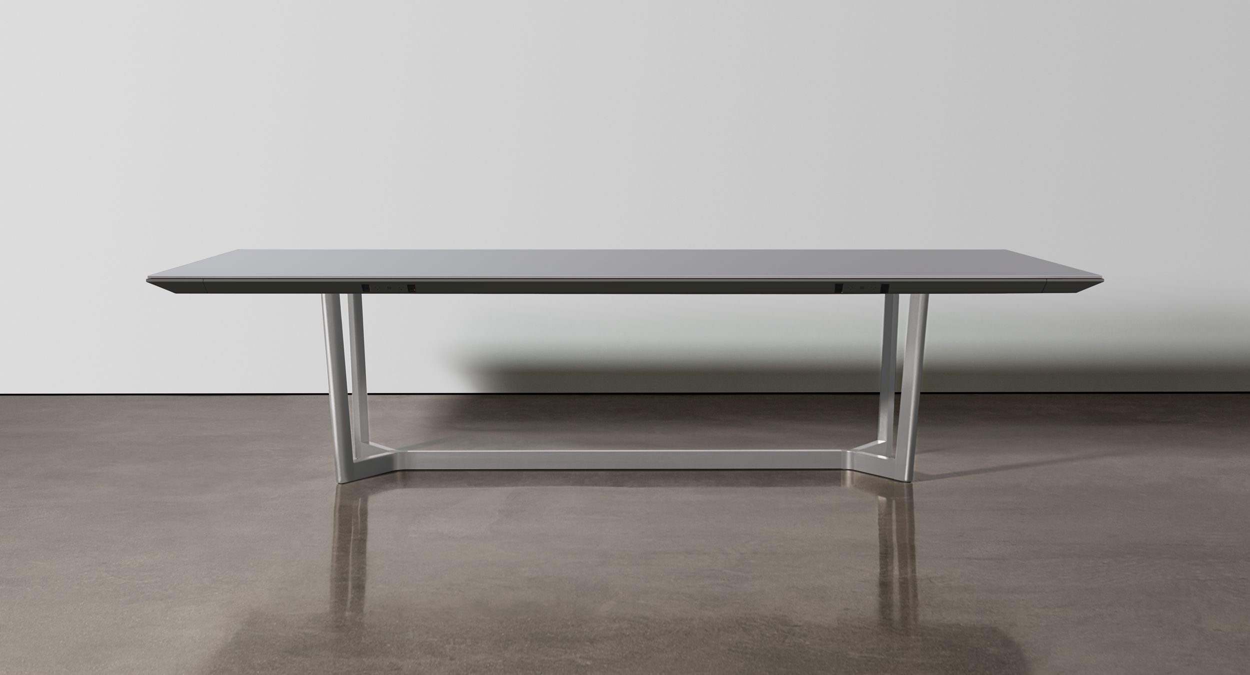 Halo table bases are offered in beautiful, brushed anodized finishes and provide concealed wire pathways to invisibly integrate technology needs.