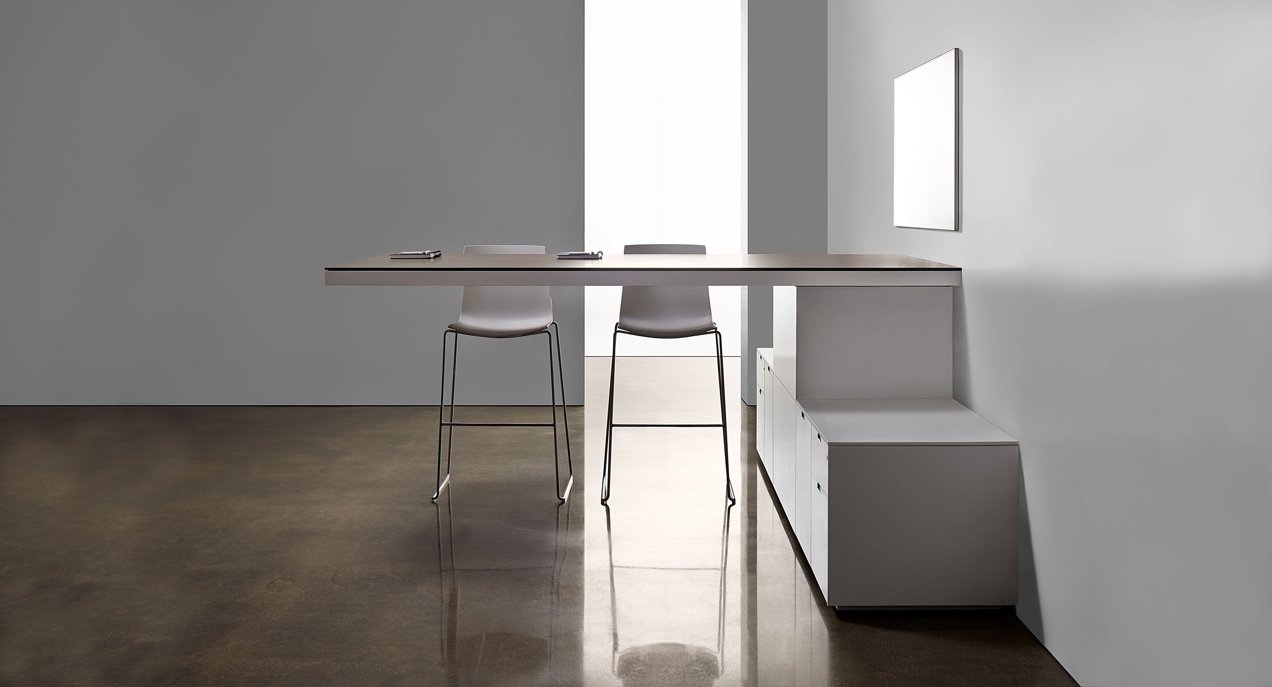 Defy gravity with a free-floating, cantilevered standing-height table.