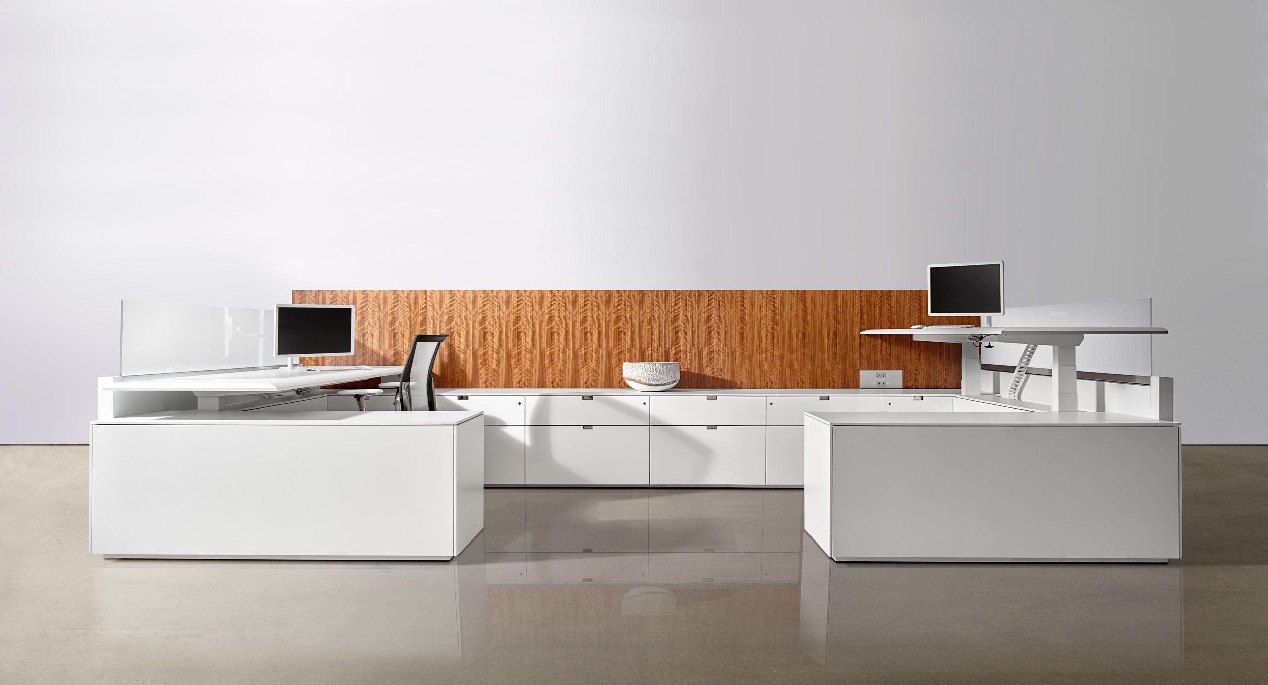 Extend beautiful casework into the open office environment with adjustable-height Lex workstations.