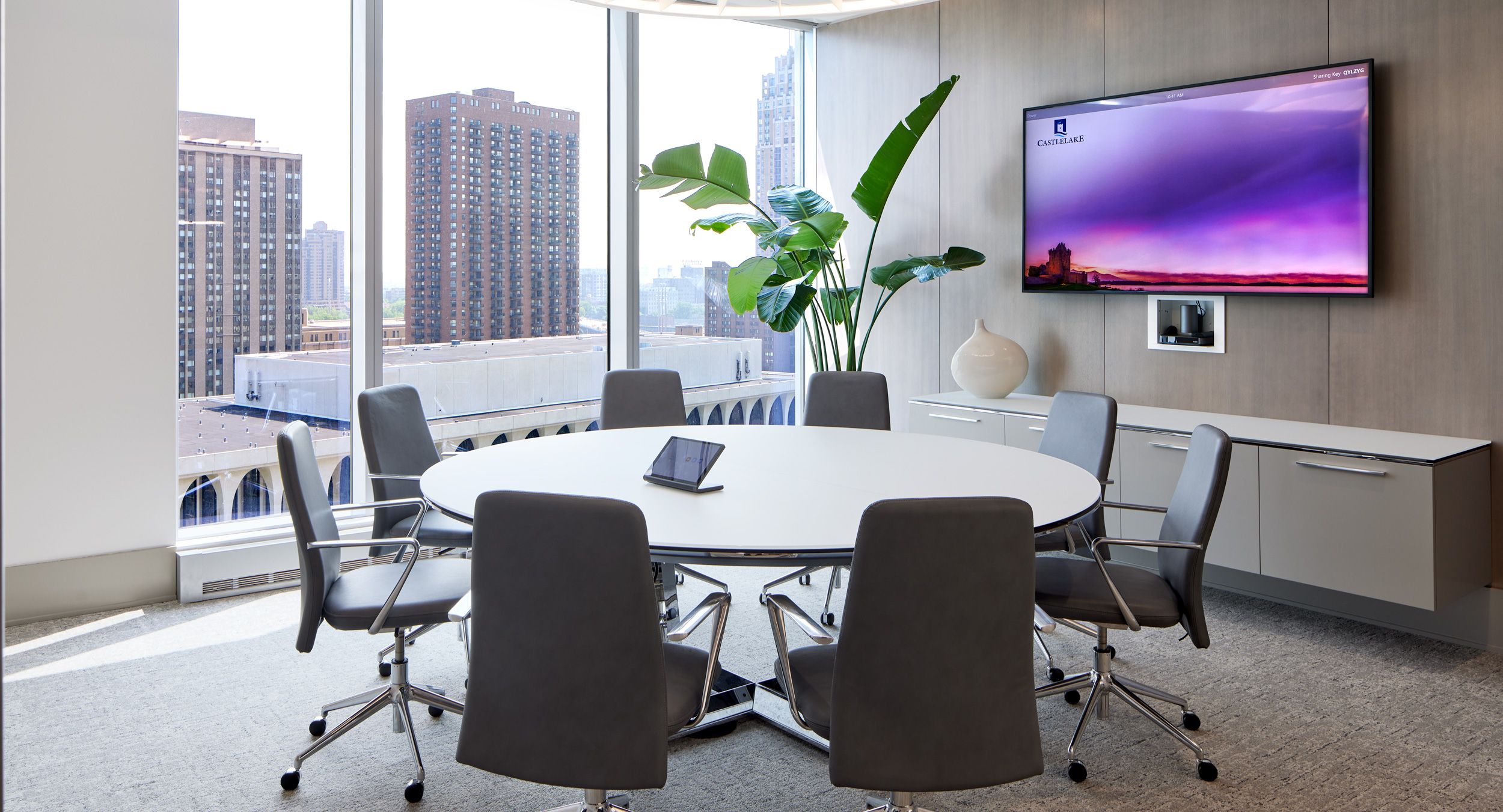 Mesa table with etched-glass surface and polished chrome loop-base is perfectly complemented by a  matching Mesa floating credenza.